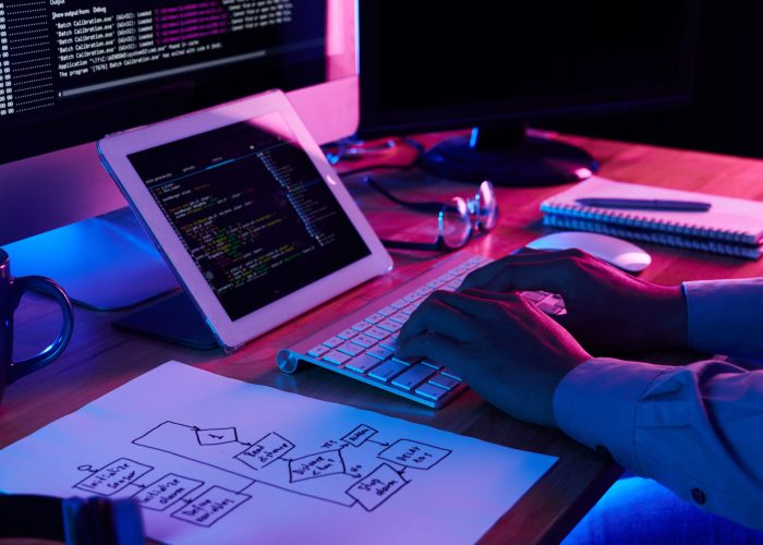 Freelance programmer Close-up image of programmer working at his desk in office